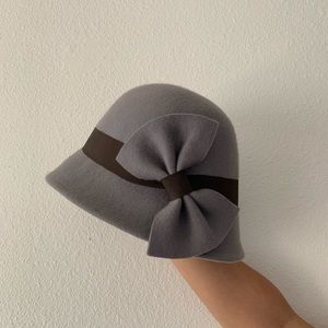 Bow trimmed wool cloche hat